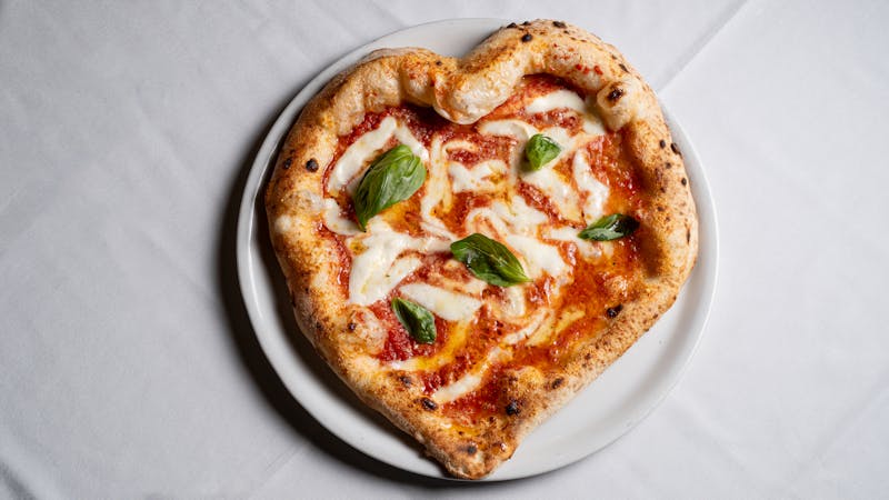 Margherita classic pizza with fresh basil and mozzarella