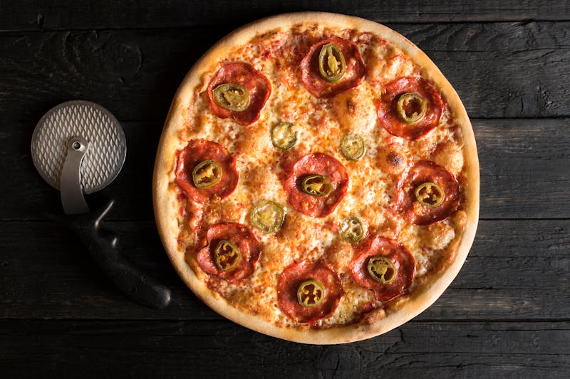 BBQ chicken pizza with smoky sauce and grilled toppings