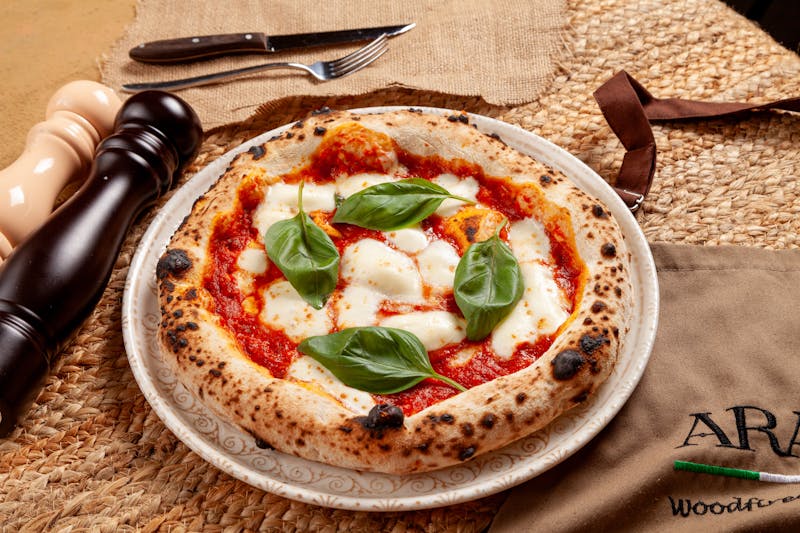 Classic Neapolitan Margherita pizza with fresh basil